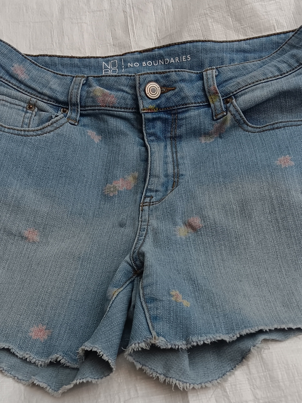 No Boundaries , brand light blue denim shorts with pastel floral accents